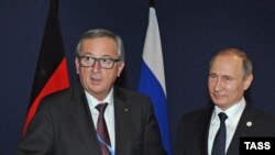 Владимир Путин (справа) и Жан-Клод Юнкер. Архивное фото