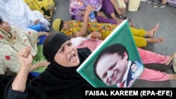 PAKISTAN -- Supporters of former Prime Minister Nawaz Sharif shout slogans a day after an the accountability court sentenced Sharif to 10 years or imprisonment, in Multan, Pakistan, 07 July 2018