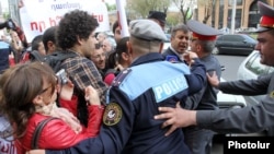 Armenia - Riot police scuffle with young activists of the opposition Armenian National Congress demonstrating outside the Yerevan Mayor's Office, 19Apr2013.