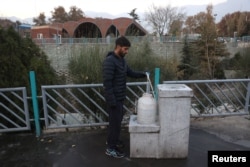 A man fills a water tank amid a drought crisis in Tehran late last year. The Iranian capital is in one of the driest provinces in the country.