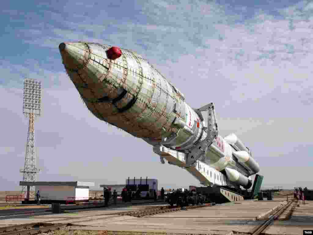 A Proton M carrier rocket with a Nimiq 5 satellite makes its way to the Baikonur launch pad in September 2009.&nbsp;