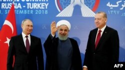 Recep Tayyip Erdogan (sağda), Hassan Rouhani (ortada) və Vladimir Putin 