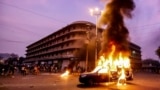 Smoke plumes from a police vehicle set on fire by supporters of Pakistan's blasphemy laws in the southern sea port city of Karachi in October 2024. (file photo)