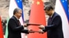 Uzbek President Shavkat Mirziyoyev (left) and Chinese President Xi Jinping attend a signing ceremony following talks in Beijing in January 2024 after agreeing to deepen their strategic partnership.