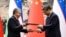 Uzbek President Shavkat Mirziyoyev (left) and Chinese President Xi Jinping attend a signing ceremony following talks in Beijing in January 2024 after agreeing to deepen their strategic partnership.