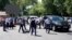 Police officers detain a man after an attack in the centre of Almaty, Kazakhstan on July 18, 2016. 