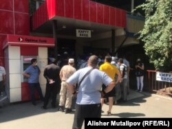 A long line for drugs at a pharmacy in Bishkek on July 13