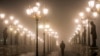 A man walks over a bridge through dense fog and smog in Skopje (file photo)