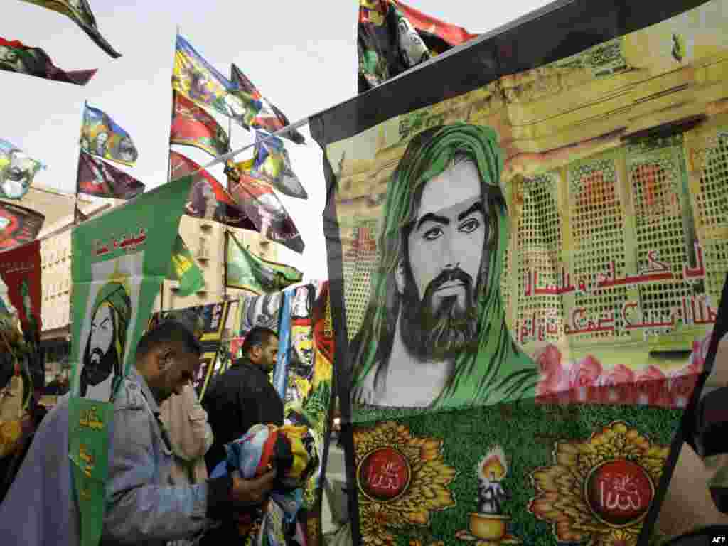 Imam Hussein's image is omnipresent at the height of Ashura and throughout the 40 days of mourning that follows. Here, street vendors in downtown Baghdad are selling pennants and other items portraying Hussein, who felt the Umayyad caliphate threatened the imposition of hereditary leadership.