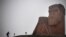 Nagorno-Karabakh - A man walks towards the iconic statue "We Are Our Mountains" outside Stepanakert on November 12, 2020.