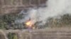 A still pictures from a drone footage shows military hardware on fire near Svitle