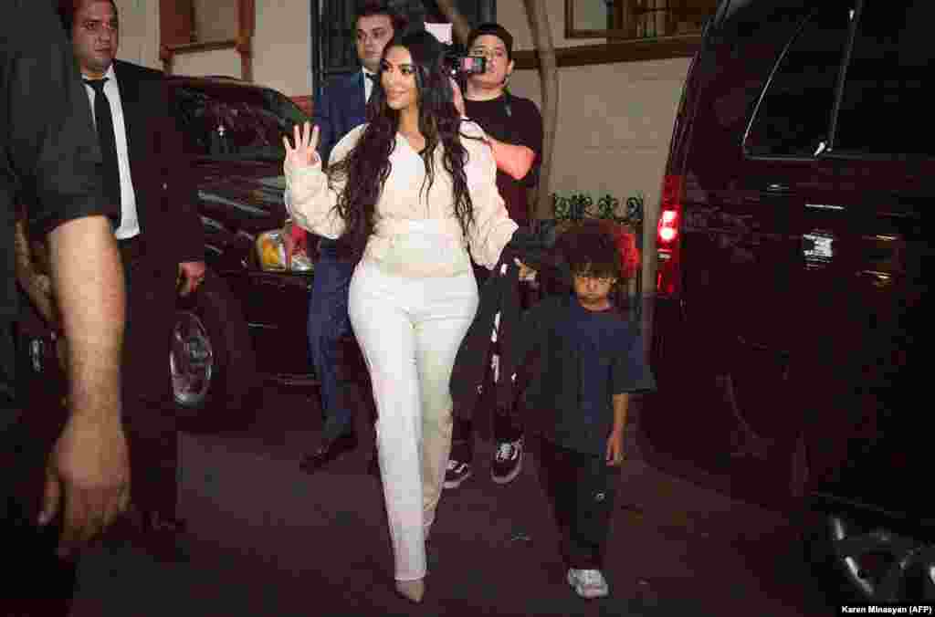 American reality TV star Kim Kardashian walks with her son Saint in Yerevan on the evening of October 7.