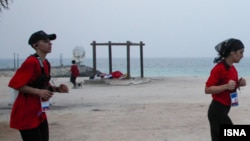 Women compete in a marathon held on the Iranian island of Kish on December 5.