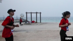 Women compete in a marathon held on the Iranian island of Kish on December 5.
