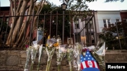 Flowers lie on the sidewalk outside Graham's home in Washington, D.C., on July 13.