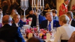 US President Donald Trump (CR) looks on as he sits next to Italy's Prime Minister Giorgia Meloni (CL) during a dinner with heads of state and government at the 'Huis ten Bosch' Royal Palace, during a North Atlantic Treaty Organization (NATO) summit in The