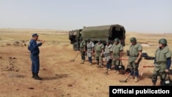 Syria -- Armenian demining experts prepare to clear a minefield near Aleppo. (Photo by the Armenian Center for Humanitarian Demining and Expertise.)