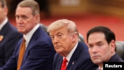 US President Donald Trump, seated next to Secretary of State Marco Rubio (right) and US Ambassador to China David Perdue during meetings in Beijing on May 14.