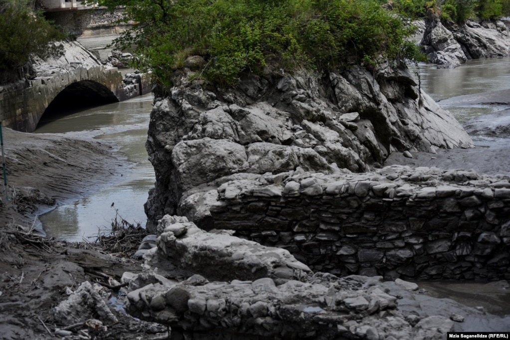 Ancient stonework (right) was exposed on May 28 when the water level was lowered.