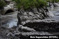 Ancient stonework (right) was exposed on May 28 when the water level was lowered.