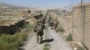 U.S. military advisers from the 1st Security Force Assistance Brigade walk at an Afghan National Army base in Maidan Wardak Province in 2018. (file photo)