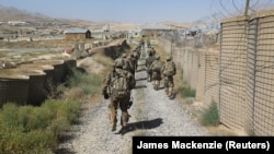 U.S. military advisers from the 1st Security Force Assistance Brigade walk at an Afghan National Army base in Maidan Wardak Province in 2018. (file photo)