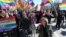 Natalya Tsymbalova (right foreground) leads a march by the Alliance of Heterosexuals for LGBT Equality in St. Petersburg.