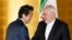 Japanese Prime Minister Shinzo Abe greets Iranian Foreign Minister Mohammad Javad Zarif at the start of their bilateral meeting in Yokohama, August 28, 2019