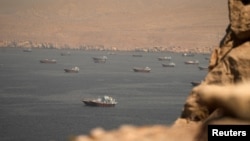 Vessels in the Strait of Hormuz, as seen from Musandam, Oman, on June 18.
