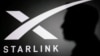 SpaceX-ի հիմնադիր Իլոն Մասկի կիսադեմը Starlink-ի լոգոյի ֆոնին, արխիվ 