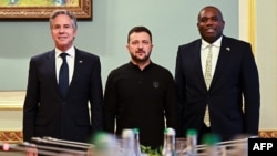 Ukrainian President Volodymyr Zelenskiy (center) renewed pleas to use Western-provided long-range missiles against targets deeper inside Russia during a visit to Kyiv by U.S. Secretary of State Antony Blinken (left) and U.K. Foreign Minister David Lammy on September 11.