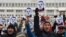 Demonstrators shouted slogans and held placards during the anti-corruption rally in Bishkek on November 25. 