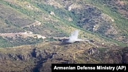 Azerbaijan -- A video grab shows the smoke from the explosions of the shelling by Armenian forces of an Azerbaijani army position in the Tovuz region, July 14, 2020.