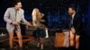 Sacha Baron Cohen (left) and Bulgarian actress Maria Bakalova joke around in character with U.S. talk-show host Jimmy Kimmel to promote the new Borat Subsequent Moviefilm.