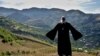 Armenia -- Priest Ter Abel prays for peace outside the village of Movses on the Armenian-Azerbaijani border, July 15, 2020