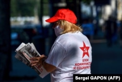 A supporter of the Electoral Bloc of Communists and Socialists (BeCS) in Chisinau on July 9.