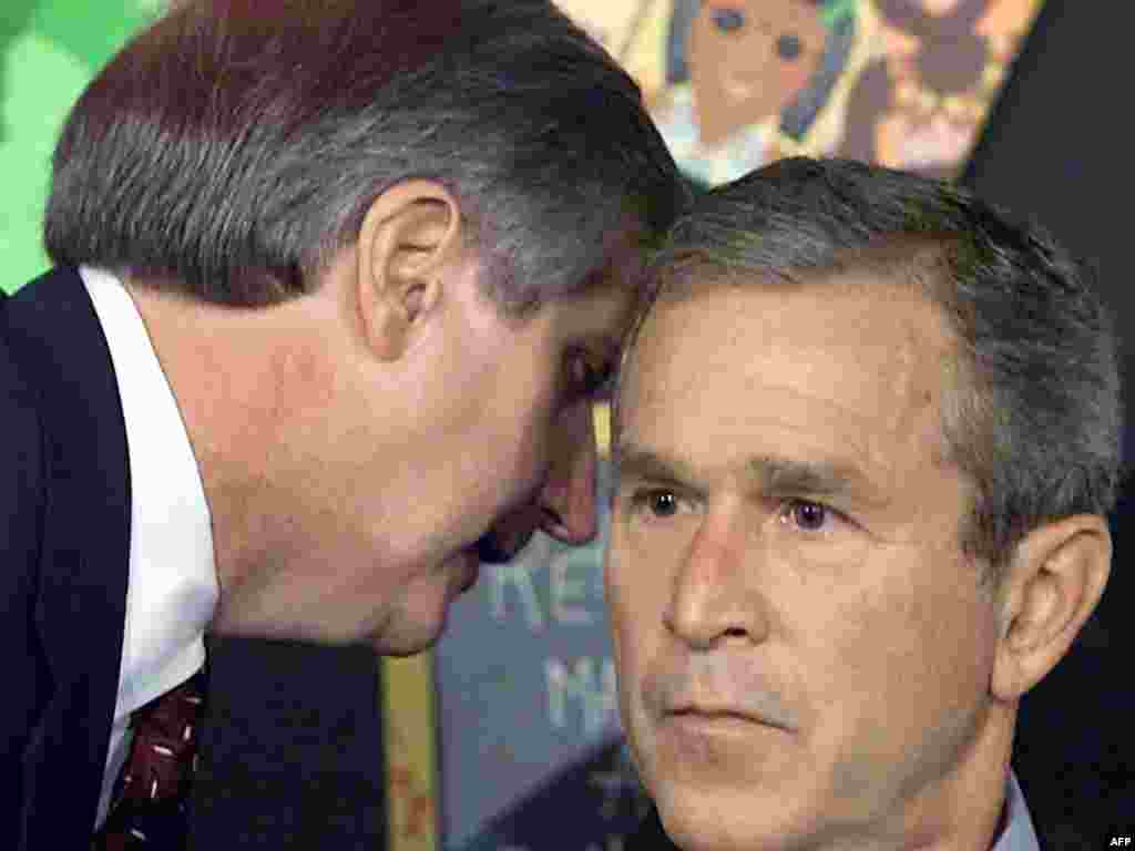 September 11, 2001 - U.S. President George W. Bush has his early morning school reading event interupted by his chief of staff, Andrew Card (left), shortly after news of the New York City airplane crashes was available in Sarasota, Florida.