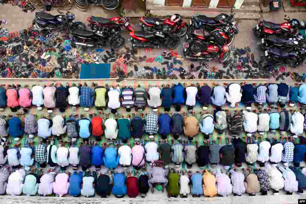 Indian Muslims offer last congregational Friday Prayers for the holy month of Ramadan on a road in Agartala on May 31. (AFP)