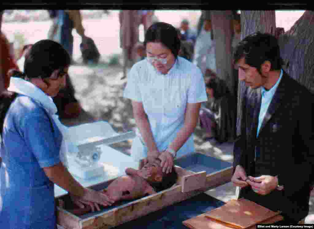 The children were being measured as a way of estimating their age, and weighed to judge nutrition.&nbsp;