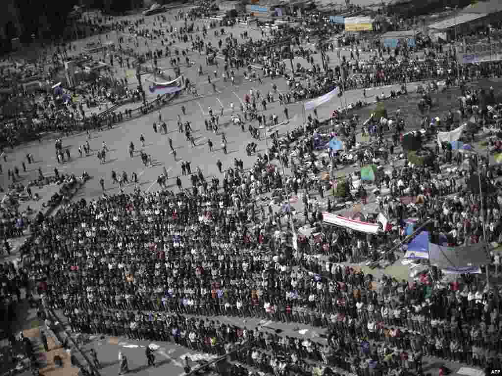 Protesters opposed to President Hosni Mubarak pray in Cairo's central Tahrir Square on February 3.