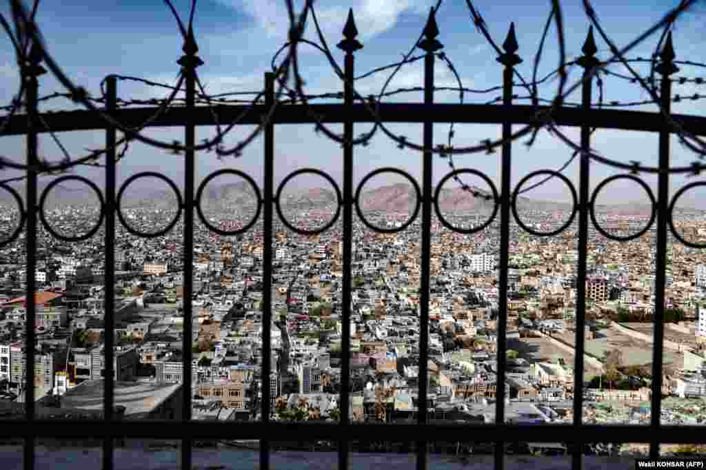 A view of Kabul through a wall fence on the Wazir Akbar Khan hilltop in the Afghan capital.&nbsp;