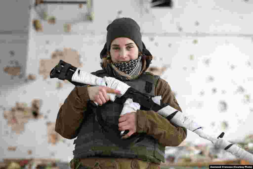 Olena, a 22-year-old fighter photographed in Marinka in January 2018. She began fighting as a volunteer aged just 17. When not on the front lines, she is studying theater directing at the Kyiv University of Culture and Arts. &nbsp; According to Stepanov, more than one-quarter of Ukraine&#39;s combatants are younger than 30, a shift from the early days of the conflict in which older, sometimes pension-age volunteers bore more of the weight of the conflict for Ukraine. &nbsp;