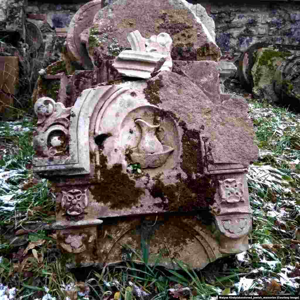 A broken tombstone in eastern Austria. The pitcher of water indicates the deceased&rsquo;s lineage to one of Judaism&rsquo;s most venerated tribes.