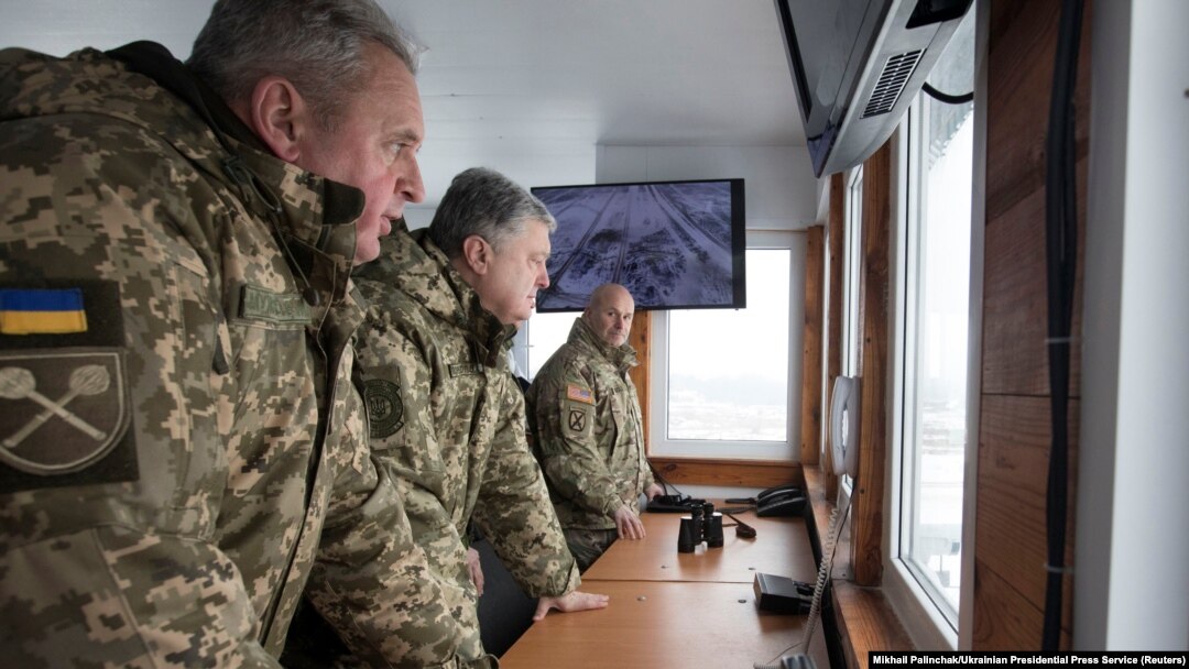 U.S. Army General Christopher Cavoli (far right) pictured with former chief of Ukrainian Armed Forces Viktor Muzhenko (left) and then-Ukrainian President Petro Poroshenko (center) observing military exercises in Ukraine in 2018.
