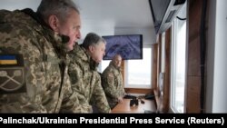 U.S. Army General Christopher Cavoli (far right) pictured with former chief of Ukrainian Armed Forces Viktor Muzhenko (left) and then-Ukrainian President Petro Poroshenko (center) observing military exercises in Ukraine in 2018.