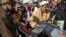 Rescuers taking an injured man to a hospital following an attack by gunmen on the Bacha Khan university in Charsadda near Peshawar in Pakistan's Khyber Pakhtunkhwa province on January 20.