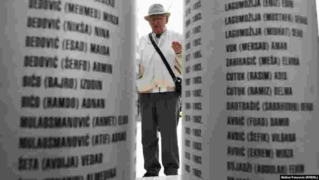 A man pays his respects at a memorial to the children who died.