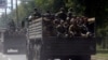 Kremlin-backed separatist fighters travel on trucks in Donetsk in July 2014.