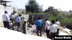 Iranian social media showing officers from the Bandar Abbas municipality destroying