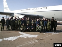 A U.S. crew flying under the Open Skies Treaty over Russia pose next to their OC-135B aircraft in Ulan-Ude, Russia, in 2006.